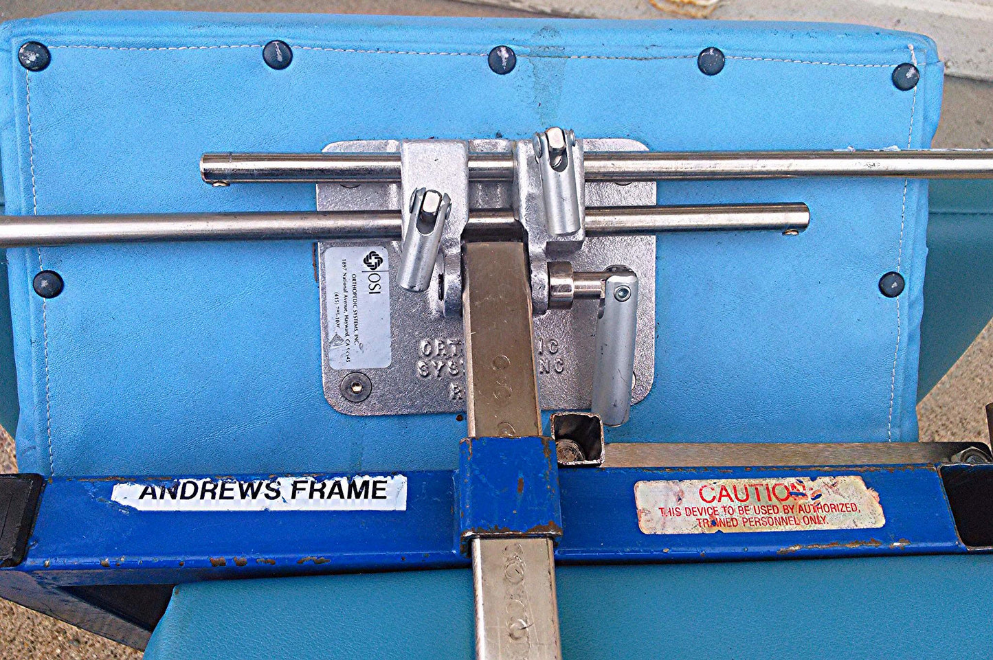 OSI ORTHOPEDIC SYSTEM OSI ANDREWS FRAME OR COCCYX ORTHOPEDIC AMSCO TABLE RACK